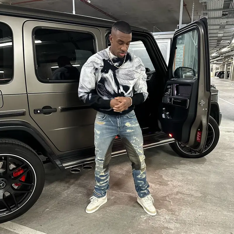 Bugzy Malone outfit in Alexander McQueen, Givenchy, and Louis Vuitton, 2023