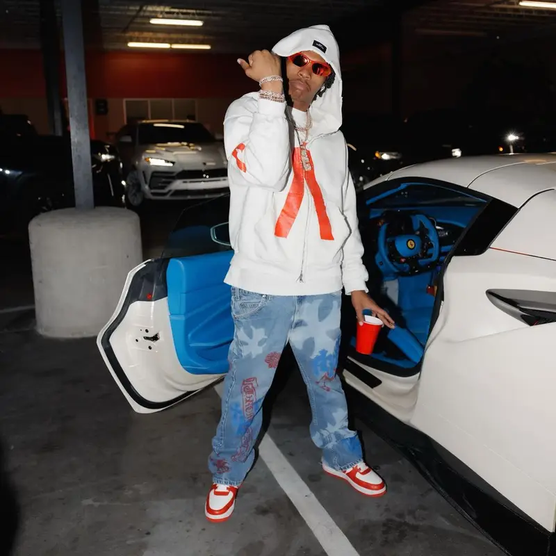 Lil Baby outfit in Louis Vuitton, Balenciaga, and Nike, 2023