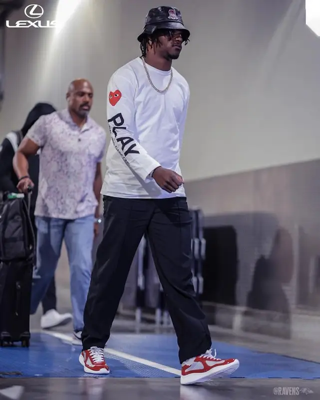 Tee Higgins outfit in Comme Des Garcons, Prada, and Avirex, 2024