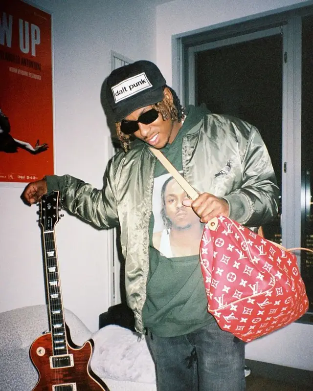 Rich The Kid outfit in Staple, Louis Vuitton, and Enfants Riches Deprimes, 2024