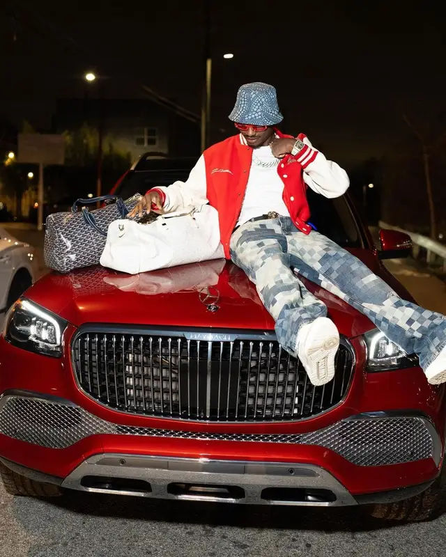 Lil Tjay outfit in Goyard, Louis Vuitton, and Yayoi Kusama, 2024