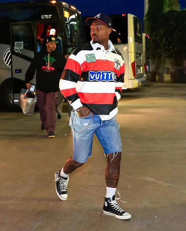 Stefon Diggs outfit in Louis Vuitton, Converse, and New Era, 2024