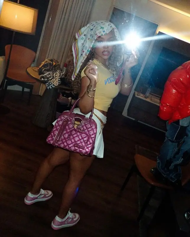 Latto outfit in Chanel, Louis Vuitton, and Takashi Murakami, 2024