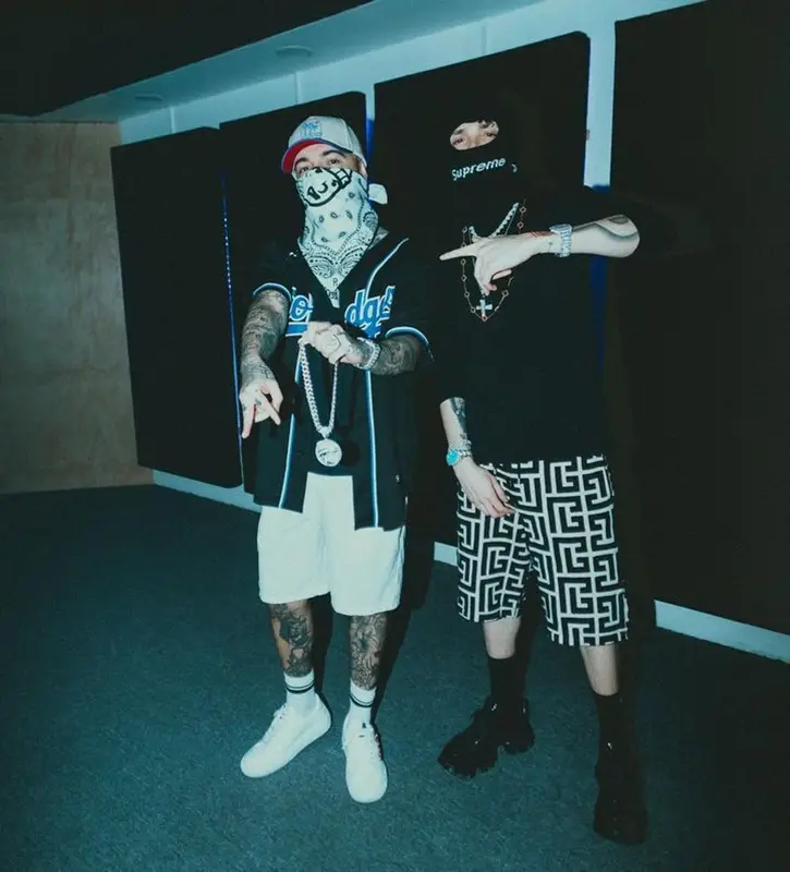 Peso Pluma outfit in Celine, Supreme, and New Era, 2024