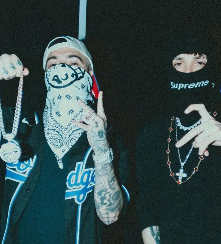 Peso Pluma outfit in Celine, Supreme, and New Era, 2024