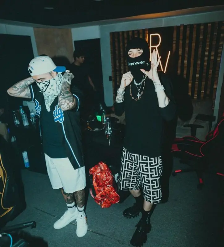 Peso Pluma outfit in Celine, Supreme, and New Era, 2024