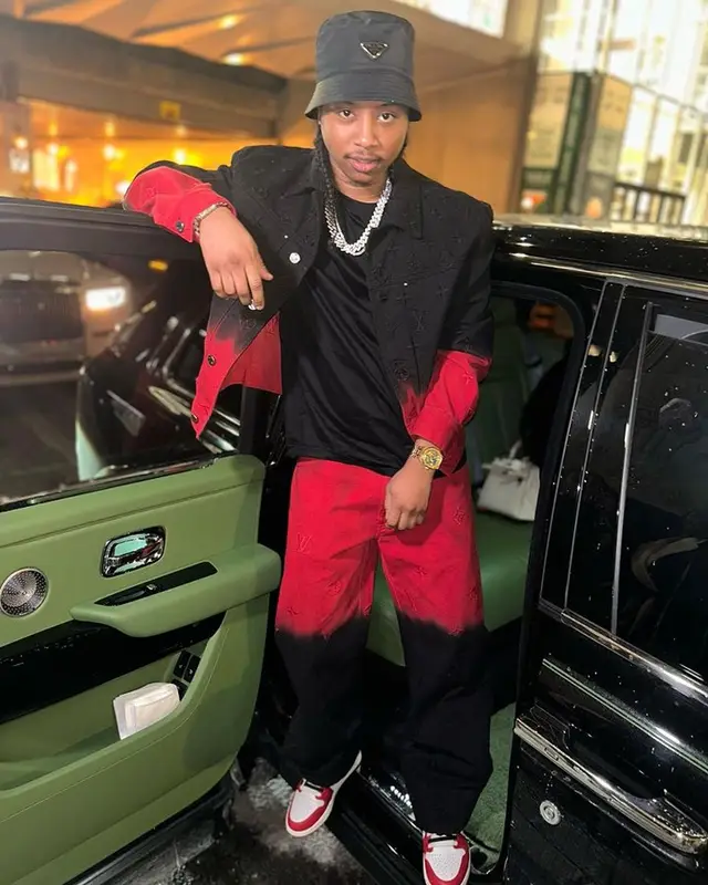 Pressa outfit in Louis Vuitton, Nike, and Prada, 2024