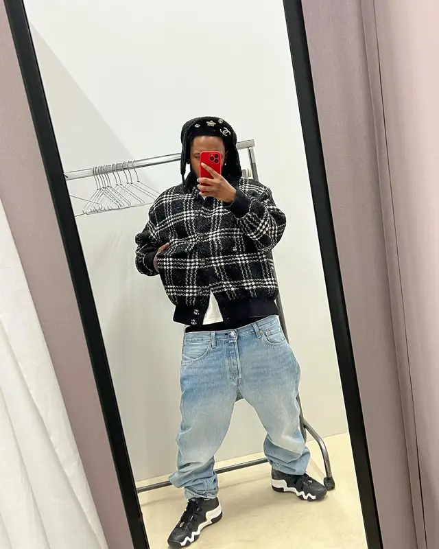 Kendrick Lamar outfit in Chanel, Levi’s, and Adidas, 2024