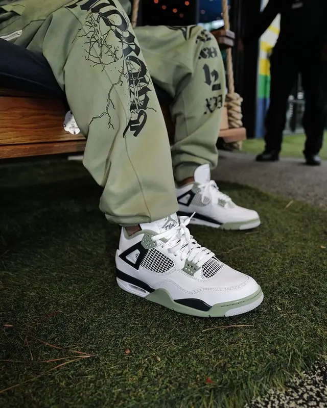 DJ Khaled outfit in Nike, Jordan, and Louis Vuitton, 2024