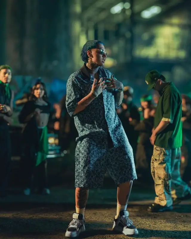 Blessd outfit in Supreme, Louis Vuitton, and The North Face, 2024