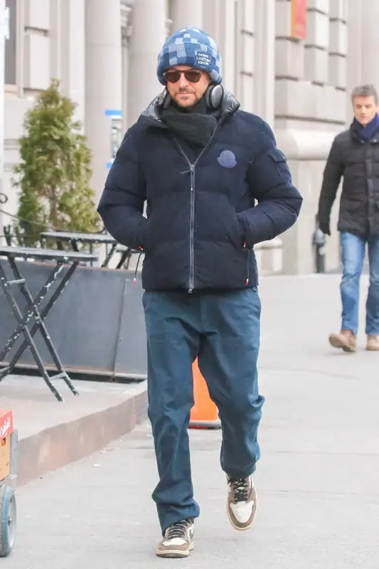 Bradley Cooper outfit in Moncler, Louis Vuitton, and Apple, 2024