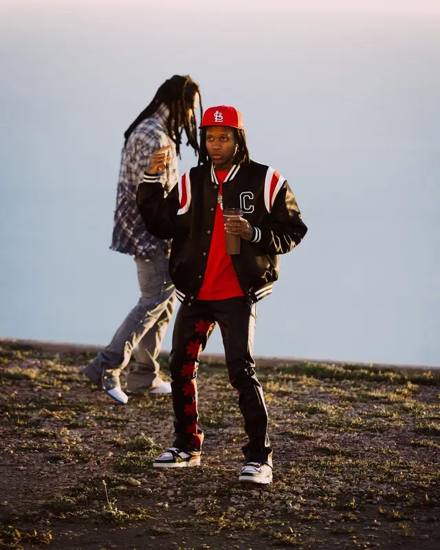Lil Durk outfit in Celine, Louis Vuitton, and New Era, 2024