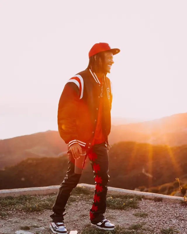 Lil Durk outfit in Celine, Louis Vuitton, and New Era, 2024