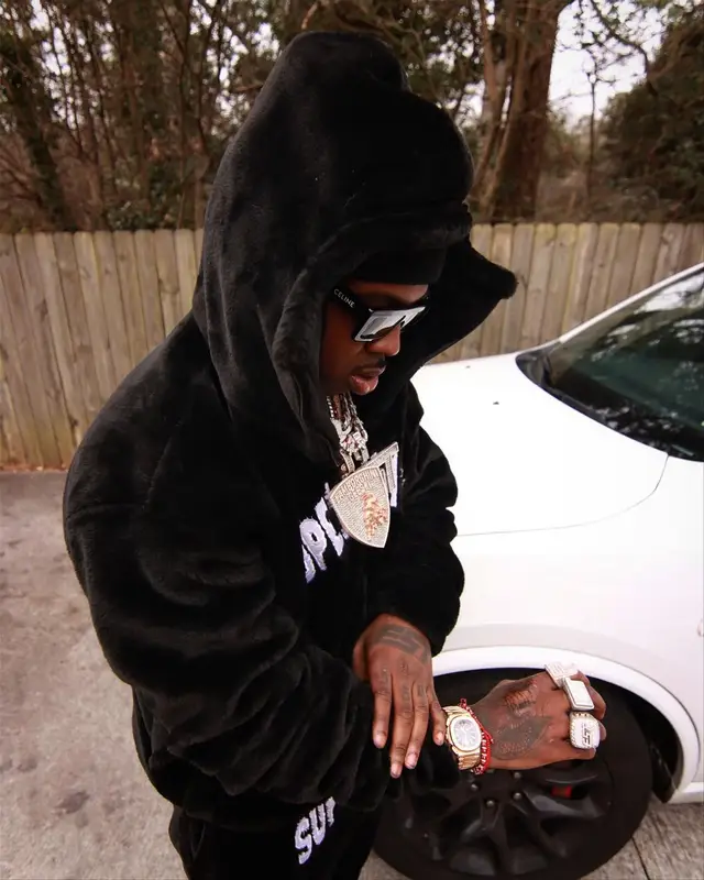 EST Gee outfit in Supervillain, Nike, and Celine, 2024