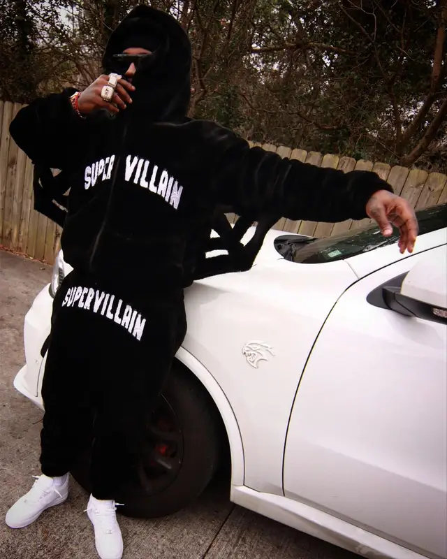 EST Gee outfit in Supervillain, Nike, and Celine, 2024
