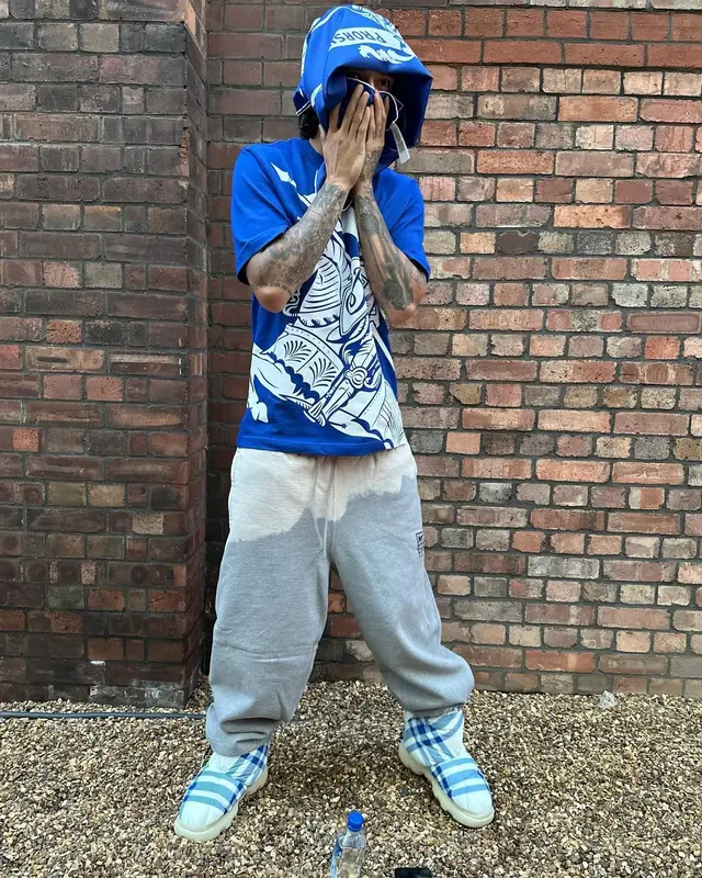 Central Cee outfit in Nike, Burberry, and Stussy, 2024