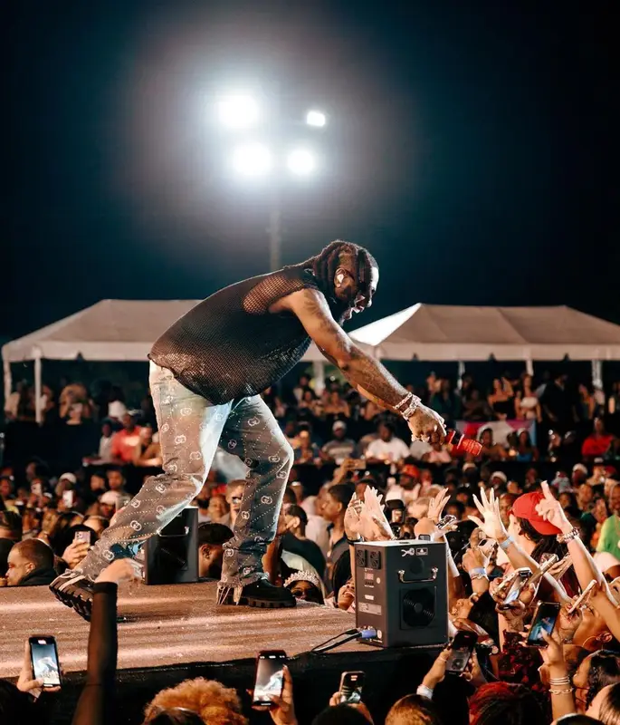 Burna Boy outfit in Gucci, Louis Vuitton, and Prada, 2024