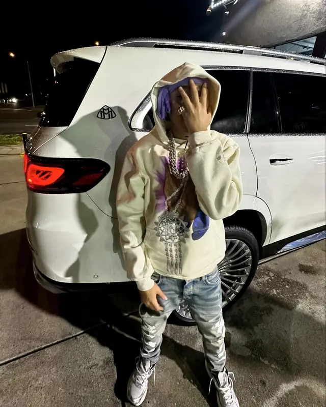 Stunna Gambino outfit in Meek Mill Merch, Amiri, and Asics, 2024