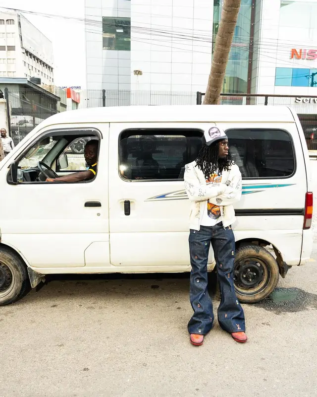 Kai Cenat outfit in Balenciaga, Louis Vuitton, and Nike, 2024