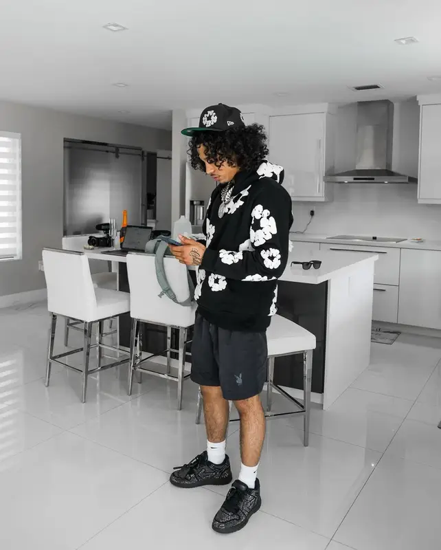 Jay Cinco outfit in Balmain, New Era, and Denim Tears, 2024