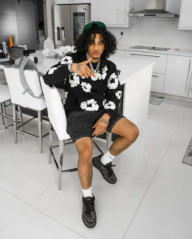 Jay Cinco outfit in Balmain, New Era, and Denim Tears, 2024
