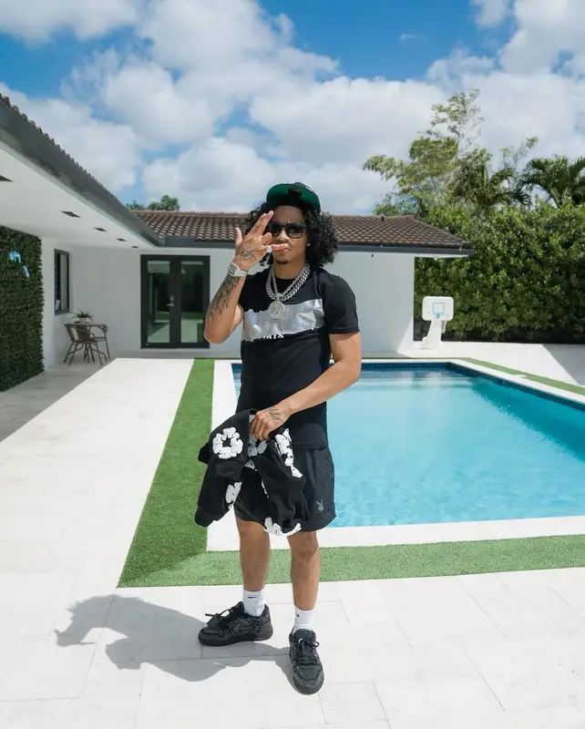Jay Cinco outfit in Balmain, New Era, and Denim Tears, 2024