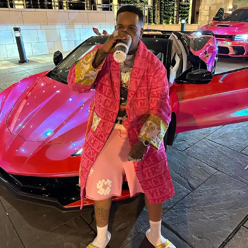 Finesse2tymes outfit in Denim Tears and Versace, 2024