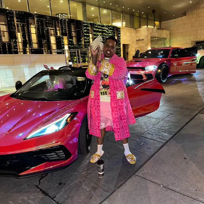 Finesse2tymes outfit in Denim Tears and Versace, 2024