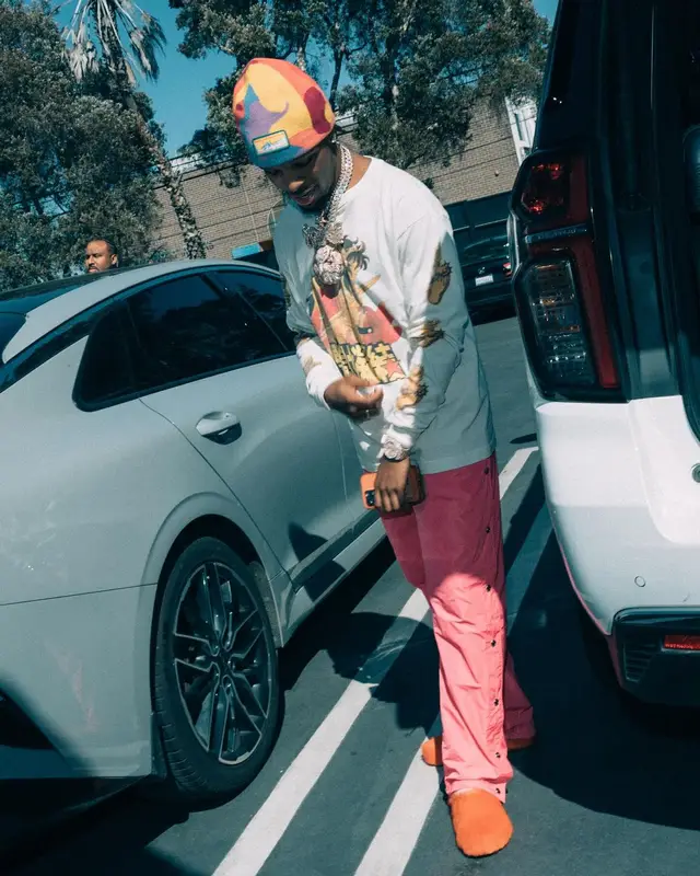 Toosii outfit in Canada Goose, NBA, and KidSuper, 2024