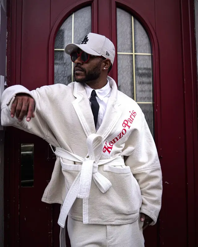 Eric Bellinger outfit in Kenzo, Dr. Martens, and New Era, 2024