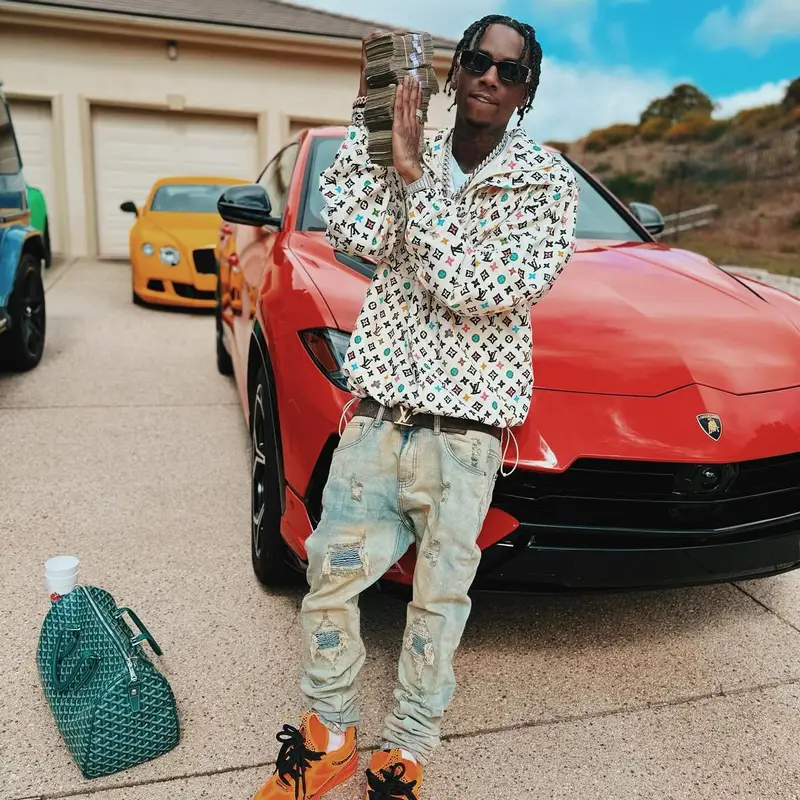 Soulja Boy outfit in Louis Vuitton, Goyard, and Balenciaga, 2024
