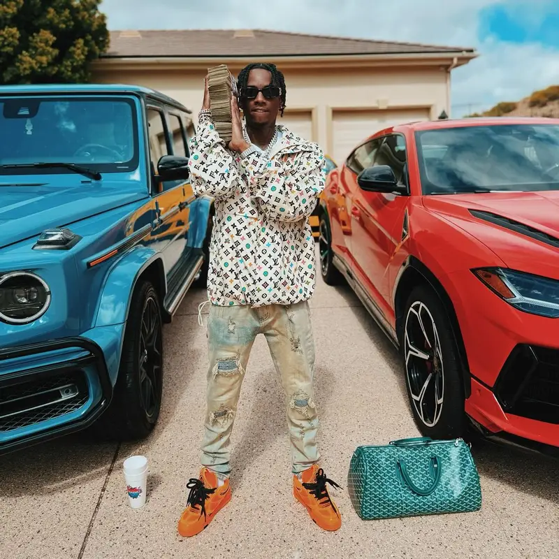 Soulja Boy outfit in Louis Vuitton, Goyard, and Balenciaga, 2024