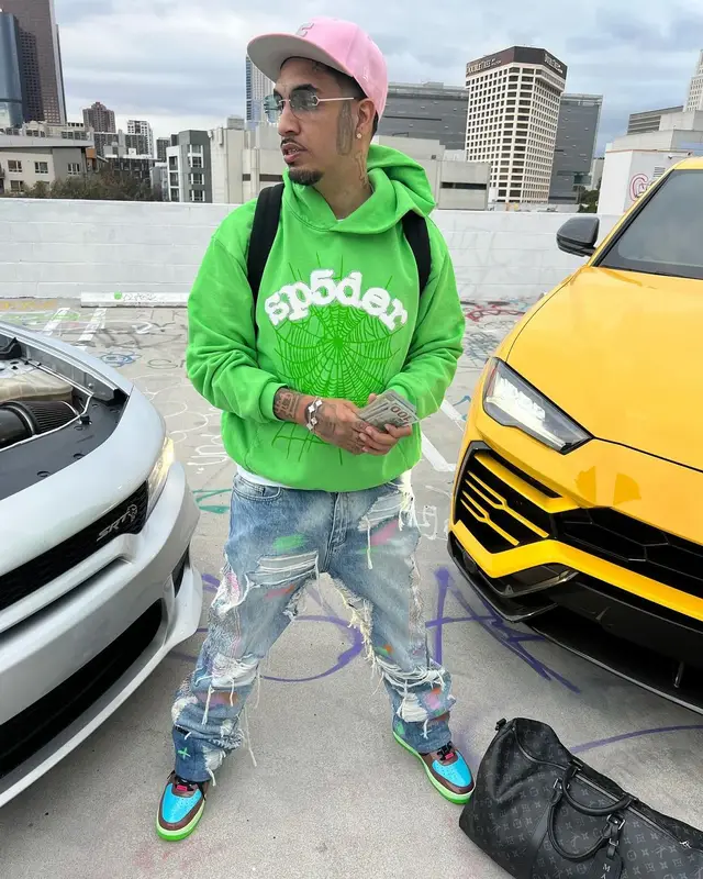 Fenix Flexin outfit in Cartier, New Era, and Fuck The Population, 2024