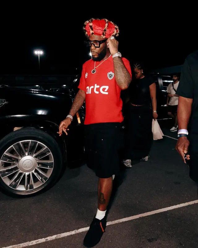 Burna Boy outfit in Arte Antwerp, Clarks, and Louis Vuitton, 2024