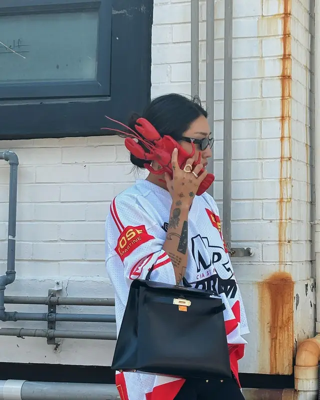 Peggy Gou outfit in Martine Rose, Hermes, and Prada, 2024