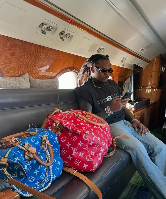 Gunna outfit in Louis Vuitton and Balenciaga, 2024