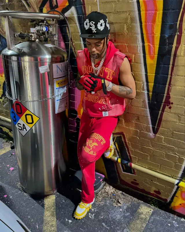 Lil Migo outfit in Denim Tears, Supreme, and Mechanix, 2024