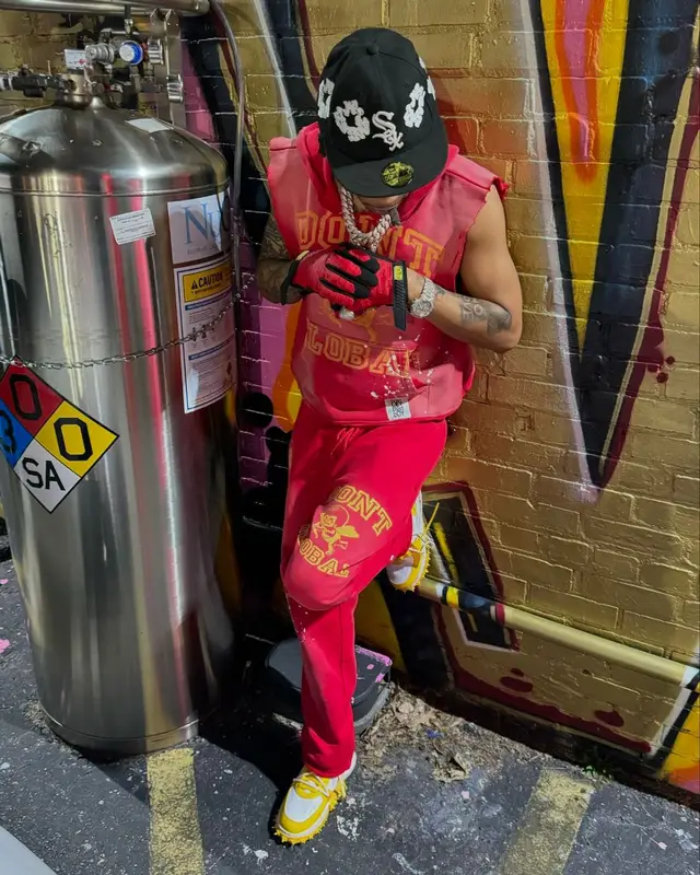 Lil Migo outfit in Denim Tears, Supreme, and Mechanix, 2024