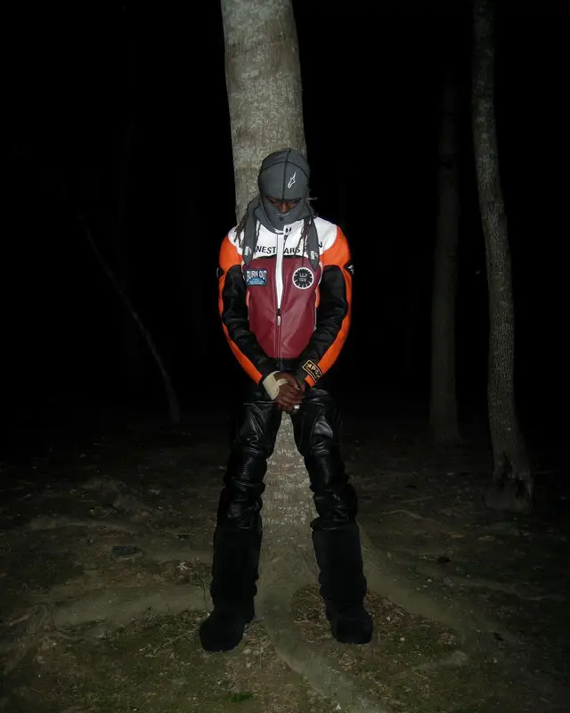 Destroy Lonely outfit in Balenciaga and Alpinestars, 2024