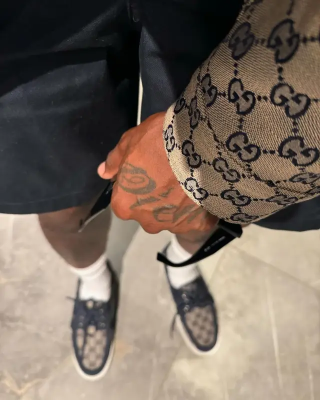 DaBaby outfit in Gucci, Prada, and New Era, 2024