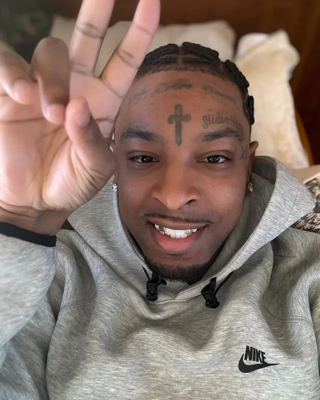 21 Savage outfit in Nike and Louis Vuitton, 2024