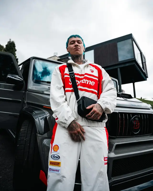 Blessd outfit in Supreme, Burberry, and Ducati Corse, 2024