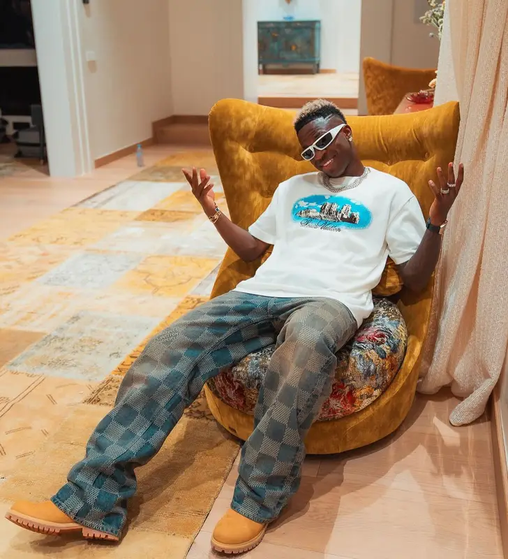 Vinicius Jr outfit in Louis Vuitton, Timberland, and Prada, 2024