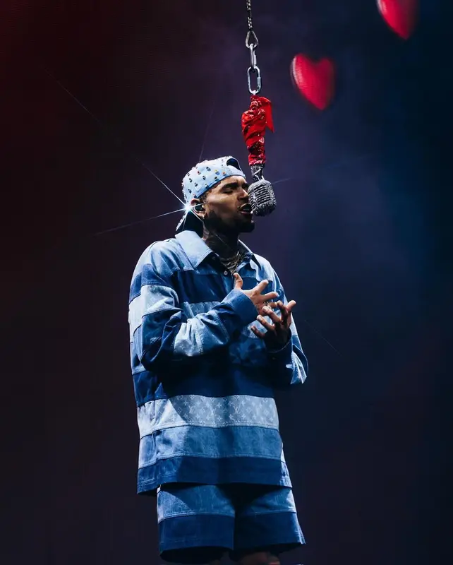 Chris Brown outfit in Louis Vuitton and Nike, 2024