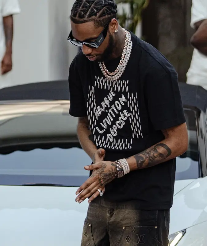 Key Glock outfit in Louis Vuitton, Nike, and Lanvin, 2024