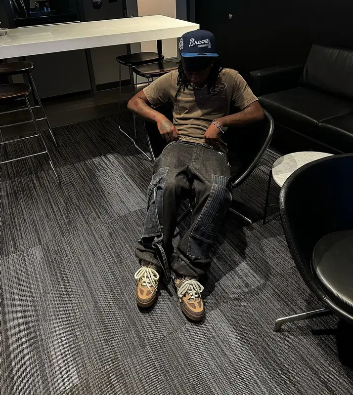 UnoTheActivist outfit in Louis Vuitton and New Era, 2024