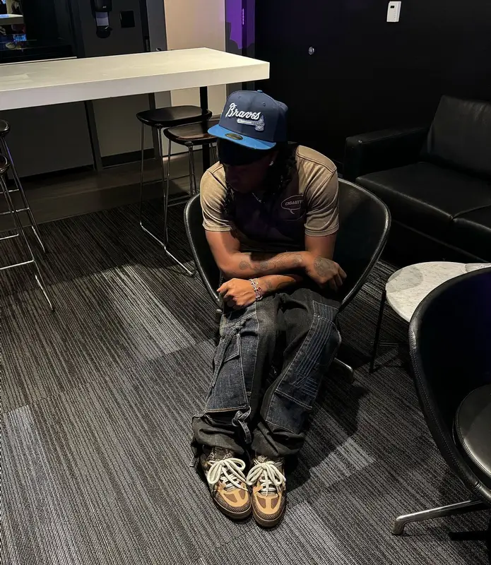 UnoTheActivist outfit in Louis Vuitton and New Era, 2024