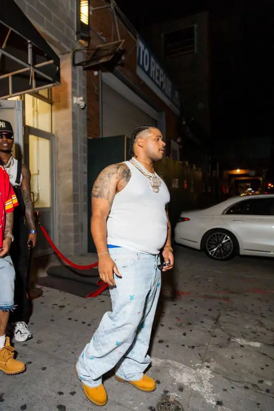 Fanum outfit in Hanes, Louis Vuitton, and Timberland, 2024