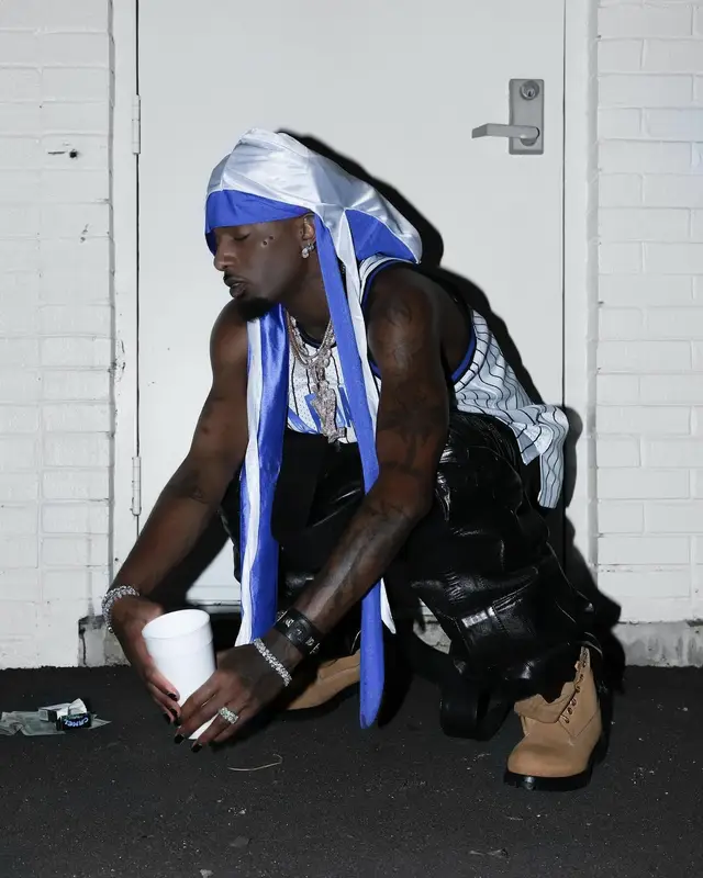 Playboi Carti outfit in Mitchell & Ness, Timberland, and Chrome Hearts, 2024
