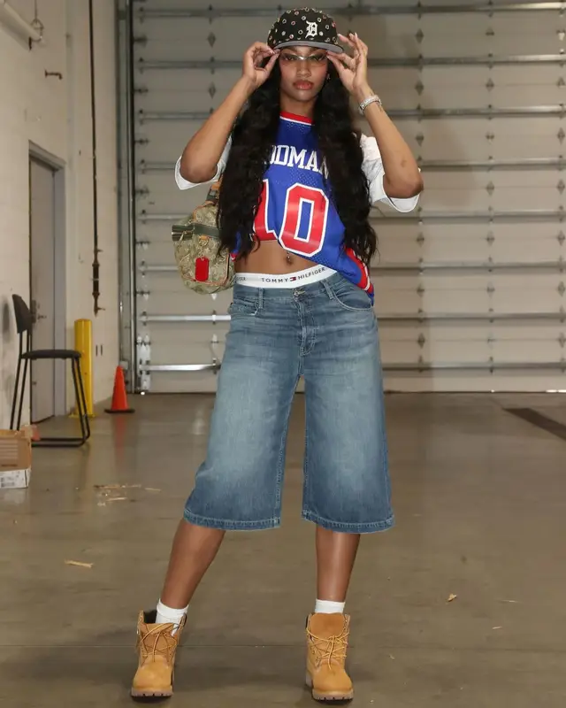 Angel Reese outfit in Mitchell & Ness, Cartier, and Chanel, 2024